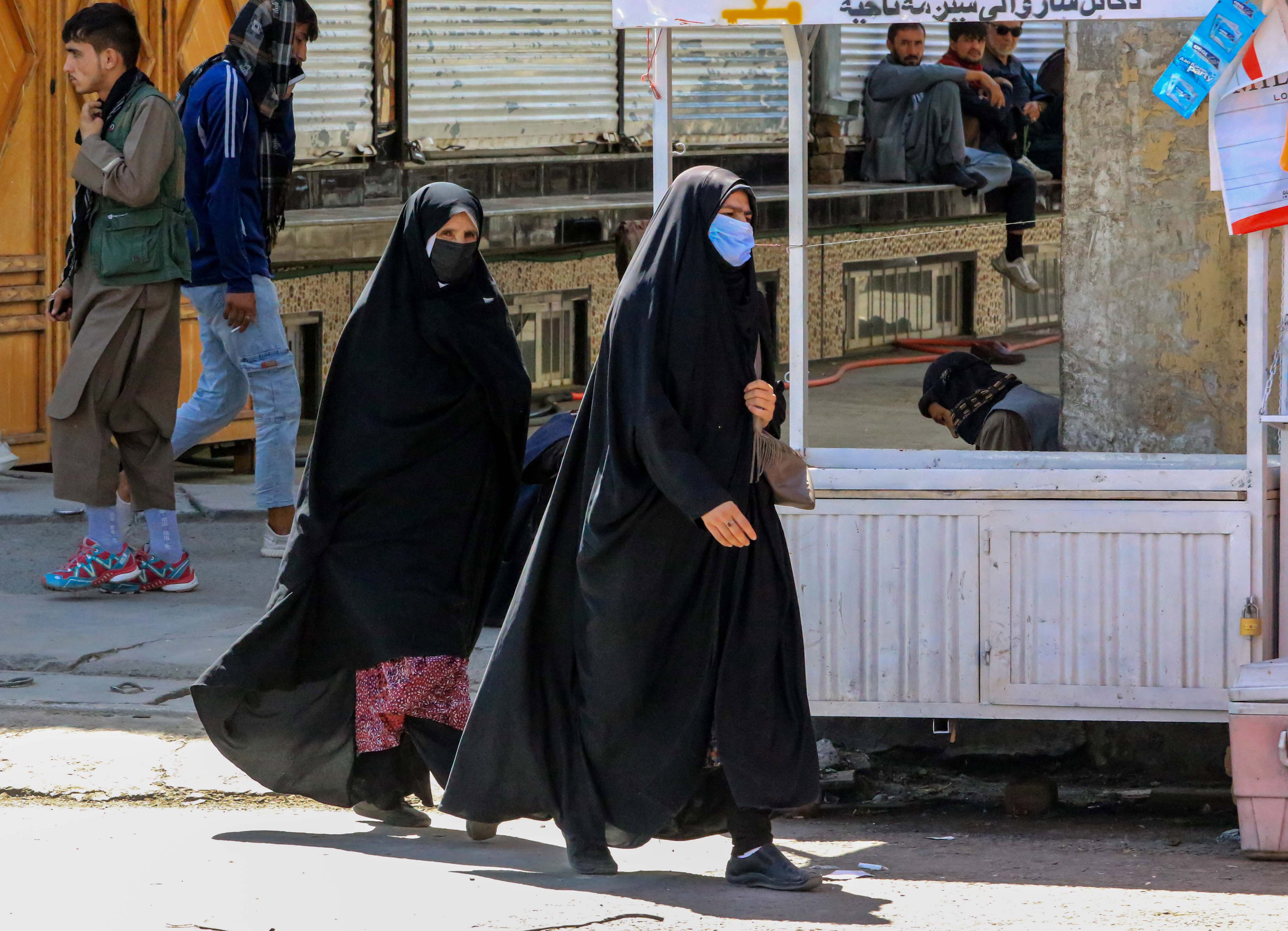 Afgan women walk on a road on the eve of the second anniversary of taking over the government in Kabul, Afghanistan, 14 August 2023. 