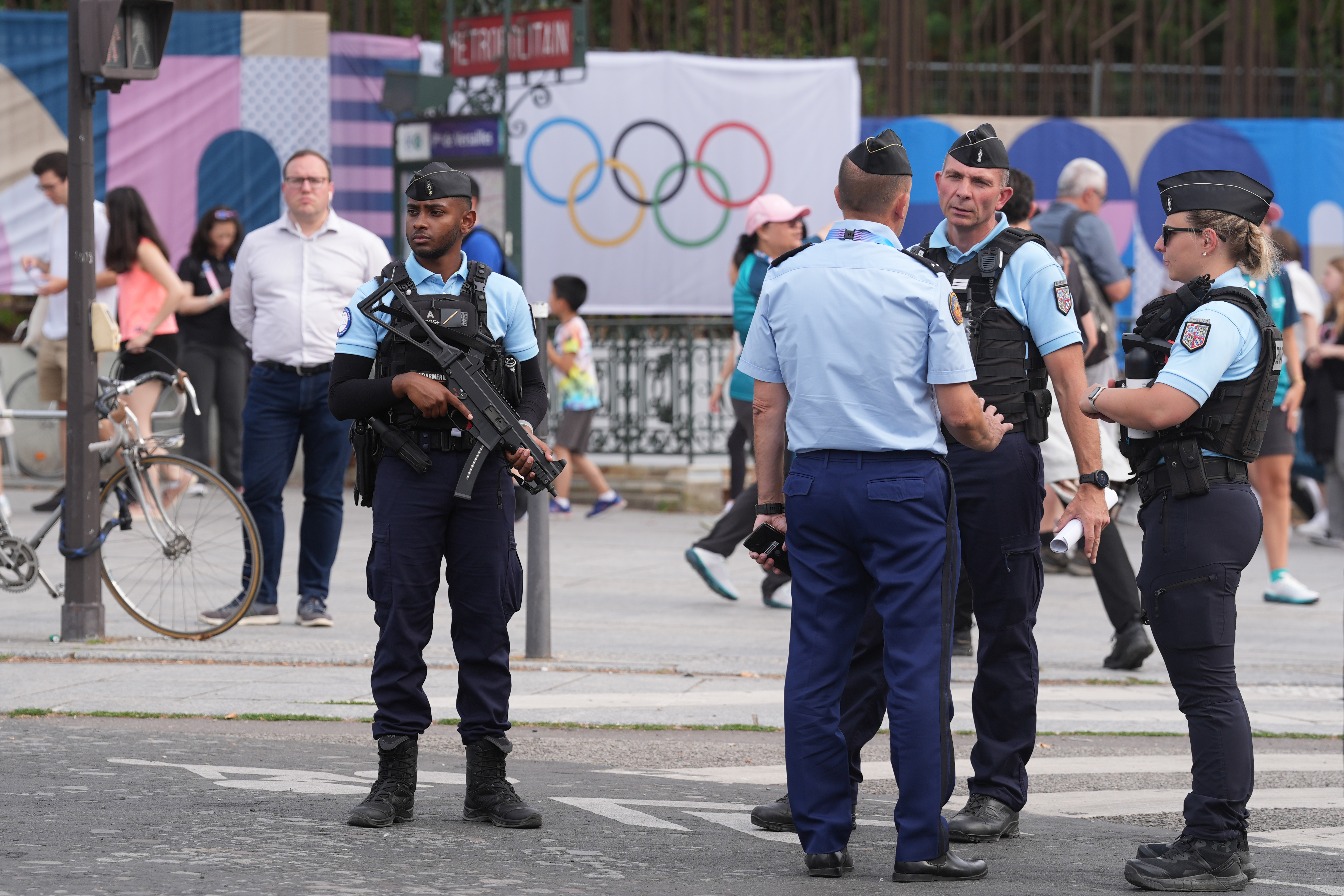 Before the Summer Olympics in Paris: Police officers stand guard in a street in Paris. 