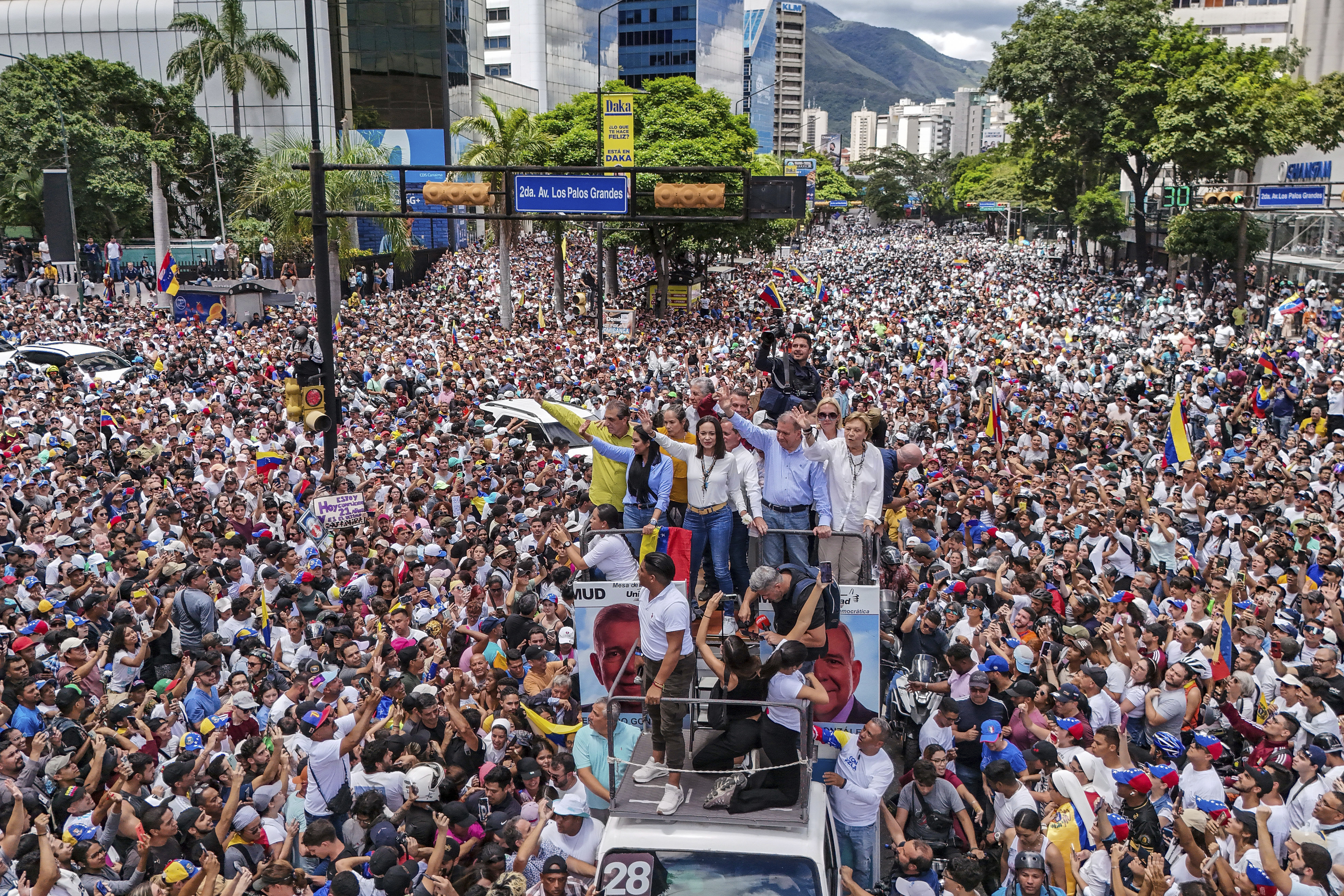 Opposition leader María Corina Machado and opposition candidate Edmundo González Urrutia ride on a truck during a demonstration against the official results of the presidential election declaring President Nicolas Maduro the winner in Caracas, Venezuela,