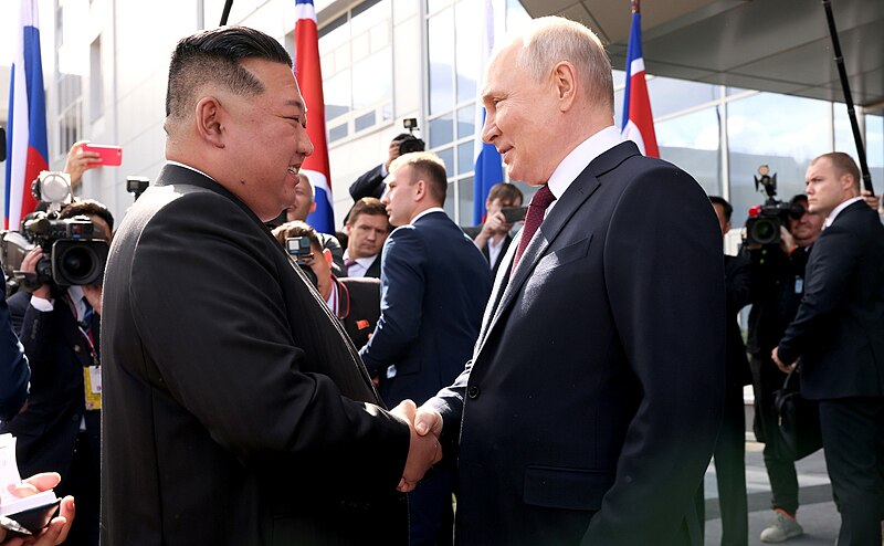 Putin and Kim shaking hands