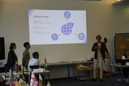 Hafizh with two other participants were presenting their final project at IAF.