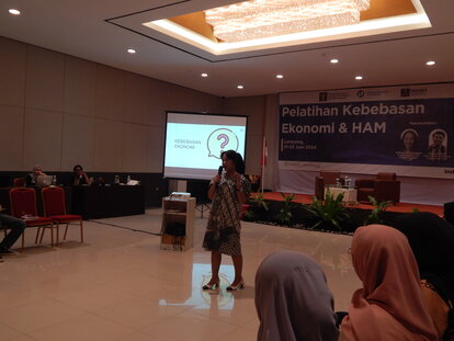 A photo of the first resource person, Ganes Woro Retnani, who is also FNF Indonesia's Program Officer