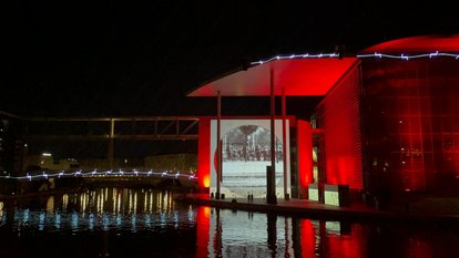 Where a few of us sat and watched a film on Germany's history in the East and West play in the form of a light show at the Reichstagufer, Berlin