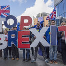 Young people demonstrating with signs "Stop Brexit"
