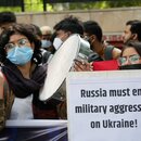 A protester with poster at Anti War protest march in New Delhi's Mandi House against the war in Ukraine