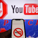 Logo of the YouTube video sharing platform on a smartphone