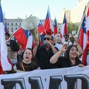 People celebrate in front of La Moneda Palace after the referendum on the proposal for a new constitution was rejected, in Santiago, Chile