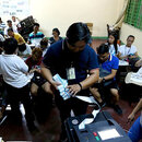 Voters PrecinctPoll watchers prepare the audit log from the vote-counting machines in Araullo High School, Manila, on May 13, 2019