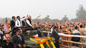 Prime Minister Narendra Modi greets people in Varanasi
