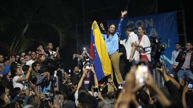 Opposition presidential hopeful Maria Corina Machado celebrates with supporters after listening to the results naming her winner of the opposition primary election, at her campaign headquarters in Caracas, Venezuela,