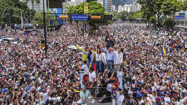 Opposition leader María Corina Machado and opposition candidate Edmundo González Urrutia ride on a truck during a demonstration against the official results of the presidential election declaring President Nicolas Maduro the winner in Caracas, Venezuela,