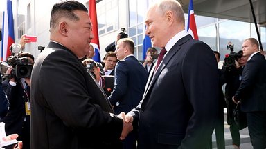 Putin and Kim shaking hands