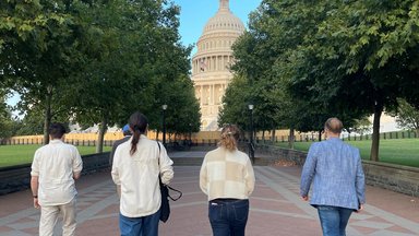 Photo of People Walking Towards the Capitol Building