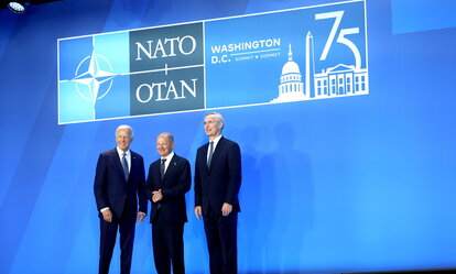 US President Joe Biden, from left, Olaf Scholz, Germany's chancellor, and Jens Stoltenberg, secretary general of the North Atlantic Treaty Organization (NATO), participate in a welcome handshake during the NATO Summit in Washington, DC, US