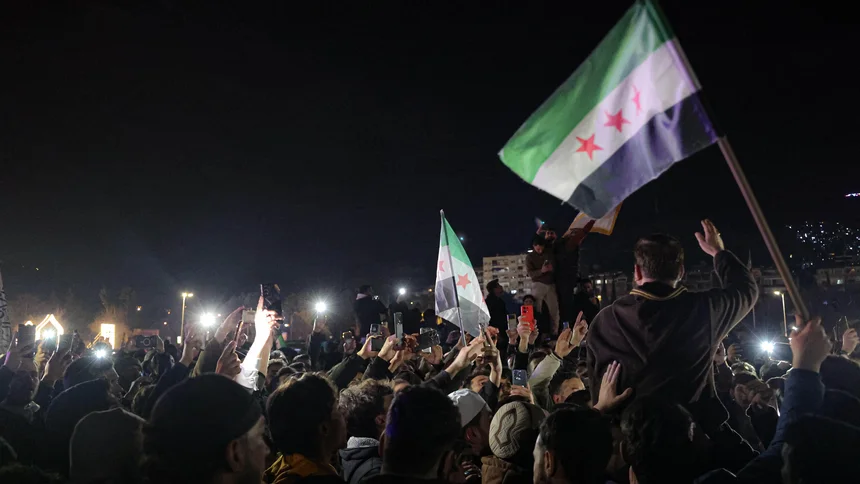 Syrians gather to protest against the attacks carried out by the forces of the ousted Assad regime against members of the General Security Administration in Latakia. 